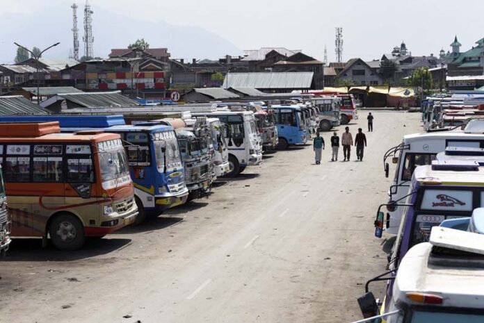 Buses parked in Srinagar due to shutdown call by the transporters on Monday. -Excelsior/Shakeel