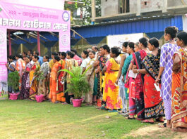 Women electors in queue outside a Polling Station of Jhargram district, West Bengal. on Thursday. (UNI)