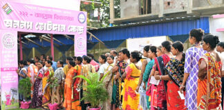 Women electors in queue outside a Polling Station of Jhargram district, West Bengal. on Thursday. (UNI)