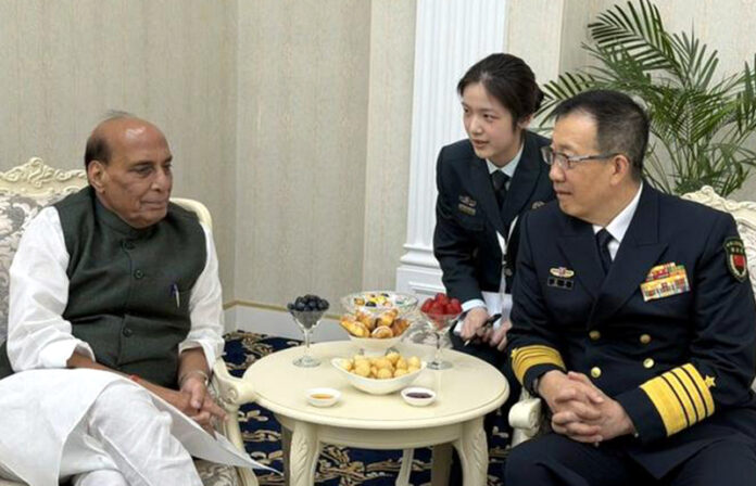 Defence Minister Rajnath Singh with his Chinese counterpart, Admiral Dong Jun at Bishkek on Tuesday.