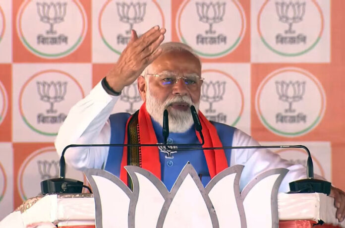 Prime Minister Narendra Modi addressing a public meeting at Katwa in Purba Bardhaman, West Bengal on Saturday. (UNI