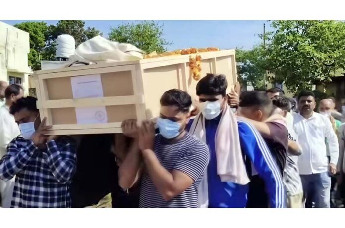 Family members carrying Sachin Khajuria’s mortal remains for last rites in Pahariwala area of Khour on Sunday.