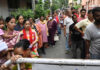 People wait in long queues to cast their votes during the West Bengal Assembly polls at the Belgachhia constituency in Kolkata on Wednesday. (UNI)