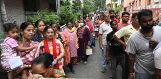 People wait in long queues to cast their votes during the West Bengal Assembly polls at the Belgachhia constituency in Kolkata on Wednesday. (UNI)