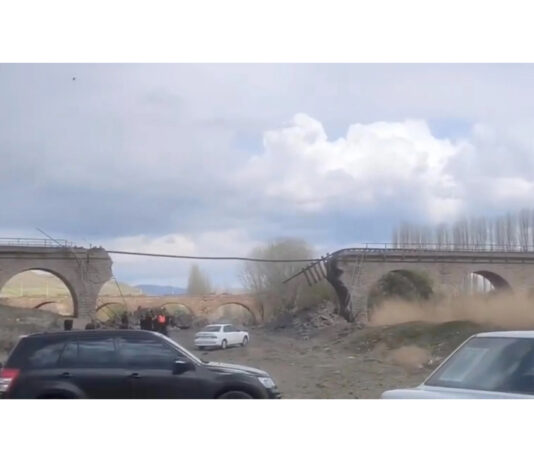A railway bridge hit in a strike near Amin Abad, Iran on Tuesday.