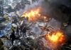 First responders and volunteers search through the rubble and burning cars at the site of an Israeli airstrike in Beirut, Lebanon on Wednesday.