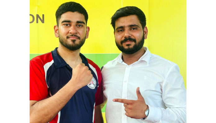 Geetansh Thakur posing along with Coach. Geetansh Thakur posing along with Coach.