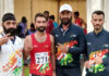 Hansraj posing with support staff during Khelo India Tribal Games in Jagdalpur, Chhattisgarh, after winning a medal.