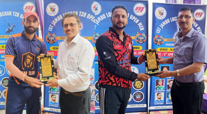 Dignitary presenting player of the match award to a player during post match presentation.
