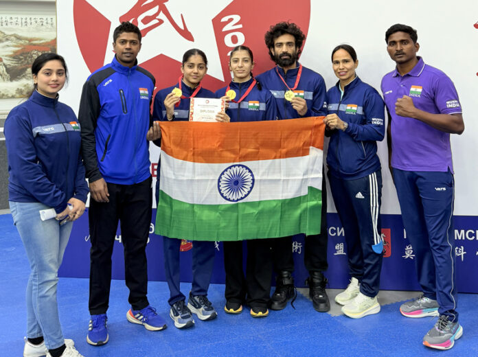 J&K Wushu athletes posing along with support staff.