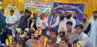 MLA Banihal, Sajjad Shaheen posing along with students during a programme.