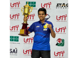 Ritvik Gupta posing with his medal and trophy after winning Under-17 National Table Tennis title.