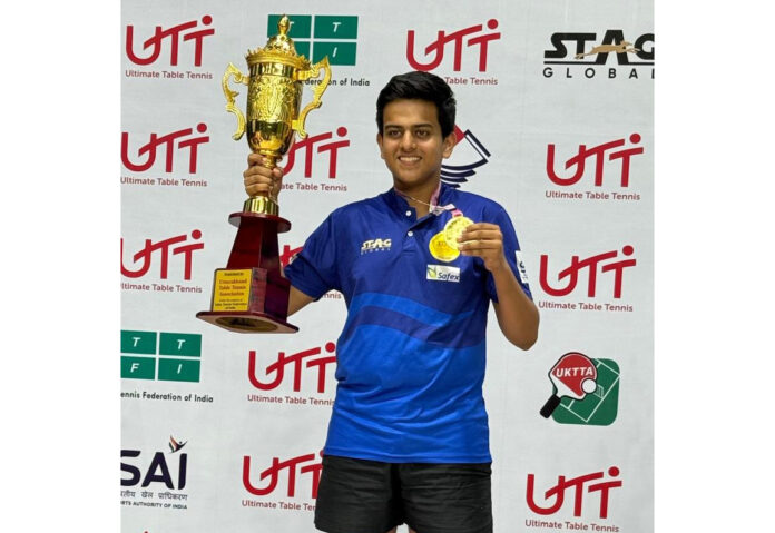 Ritvik Gupta posing with his medal and trophy after winning Under-17 National Table Tennis title.