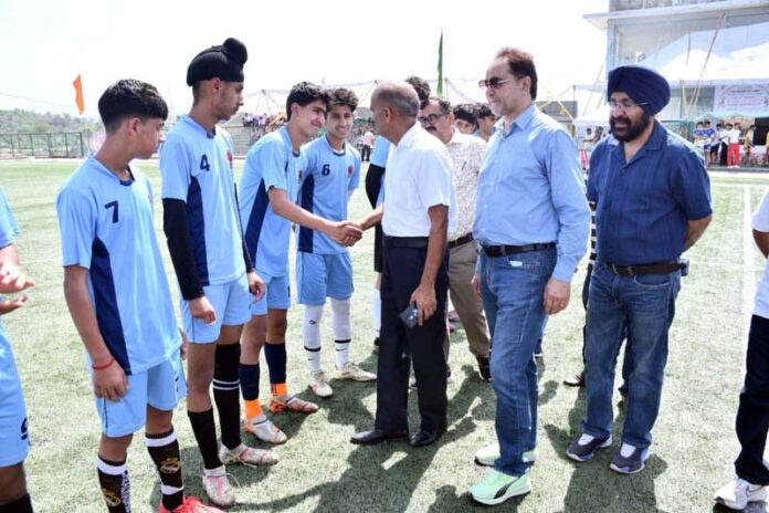 A senior sports officer interacting with young football players at Khel Gaon, Nagrota, Jammu.