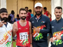 Hansraj posing with support staff during Khelo India Tribal Games in Jagdalpur, Chhattisgarh, after winning a medal.