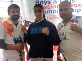 Udhampur Boxer Neelam Devi posing with her coach Rajneesh Kumar after winning bronze in Junior National Boxing Championship, in Nagpur.