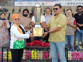 Dignitaries unveiling the tournament trophy at opening ceremony.