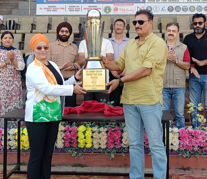 Dignitaries unveiling the tournament trophy at opening ceremony.