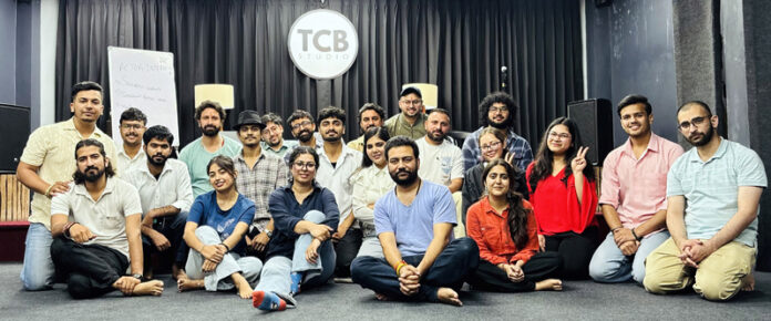 Participants posing for a group photograph during a programme.