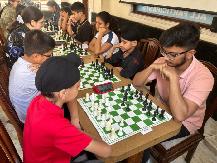 Young chess players in action during tournament.