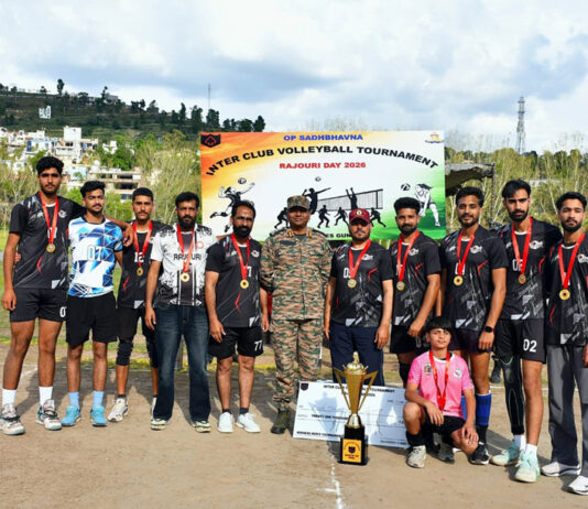 Winners posing with the trophy alongside the dignitary.