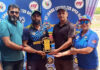 Dignitaries presenting player of the match award during post match presentation.