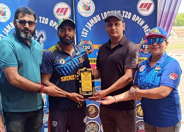 Dignitaries presenting player of the match award during post match presentation.