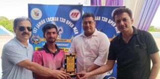 Dignitaries presenting player of the match award during post-match ceremony.