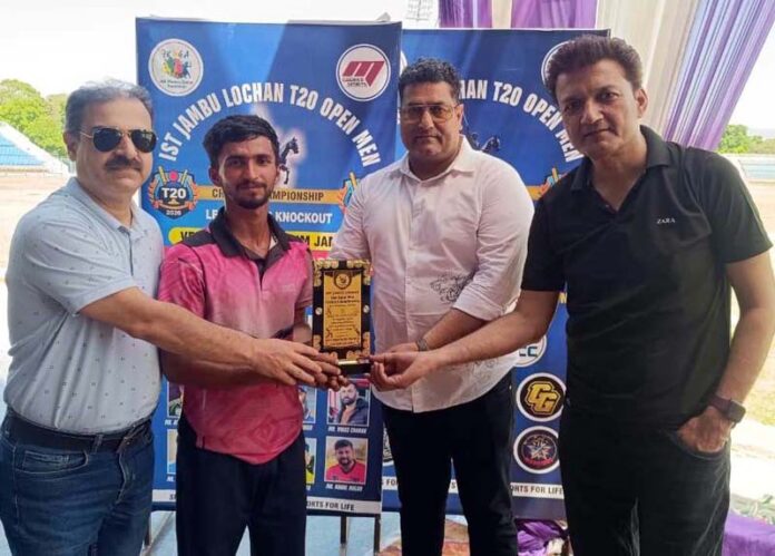 Dignitaries presenting player of the match award during post-match ceremony.