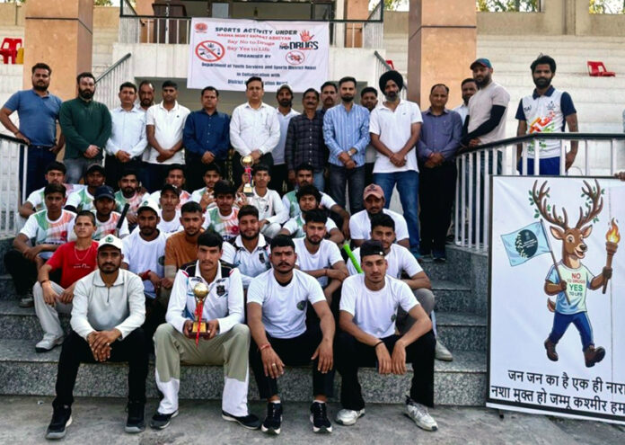 Winning team posing along with trophy during prize distribution ceremony.