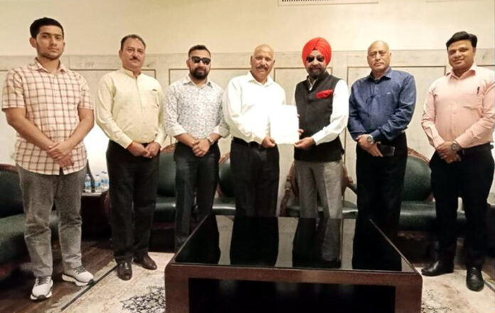 SS Sodhi honouring J&K Shooting coaches during a programme.