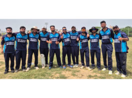 Winning team posing for a group photograph.