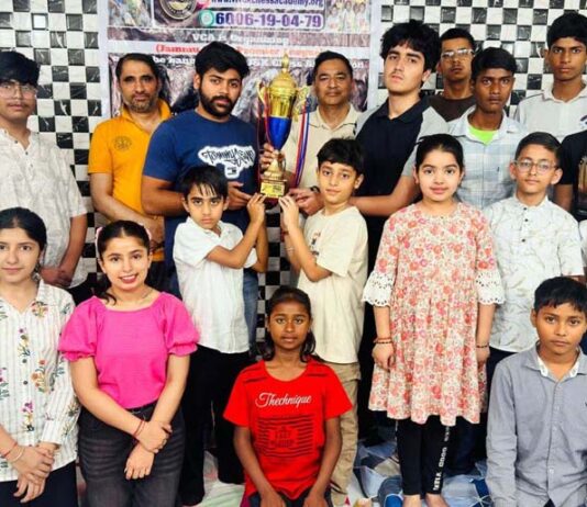 Winners posing along with trophy during a programme.