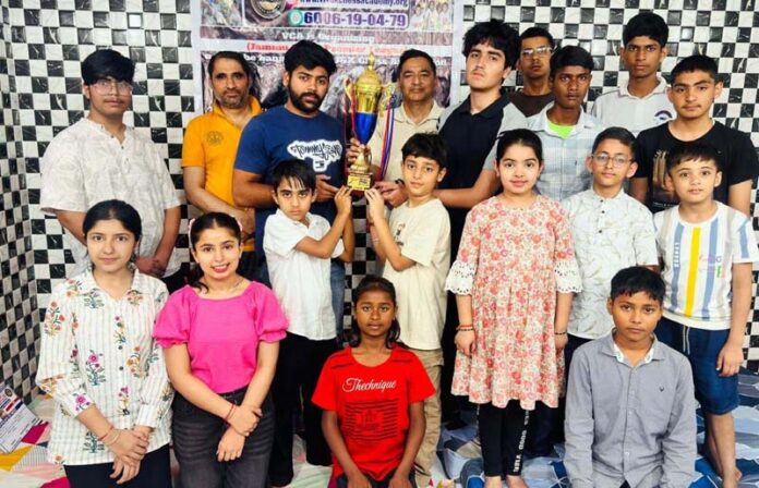 Winners posing along with trophy during a programme.