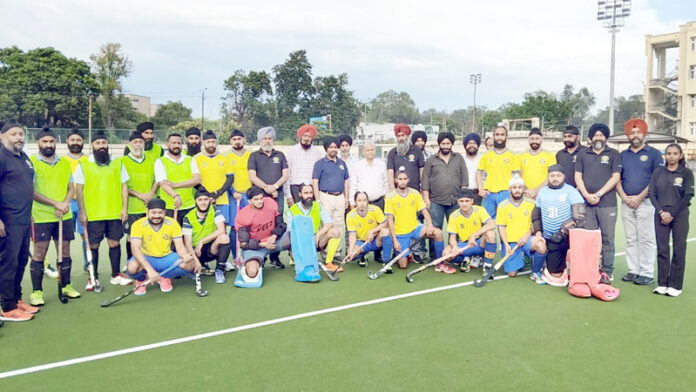 Hockey players posing along with dignitaries. Hockey players posing along with dignitaries.