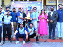Aijaz Qaiser, Joint Director Tourism Jammu presenting trophy to winning team.