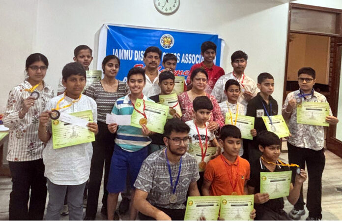 Winners posing along with certificates during closing ceremony.