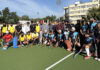Hockey players posing along with dignitaries during the programme.