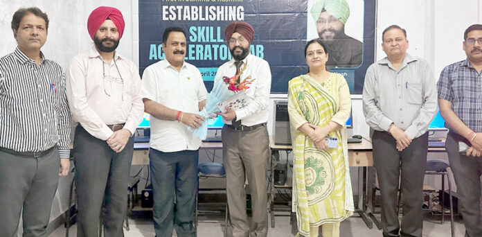 Management presenting bouquet to chief guest during an event.
