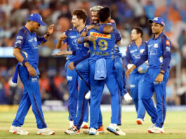 MI players celebrating after defeating Gujarat Titans in Ahmedabad.