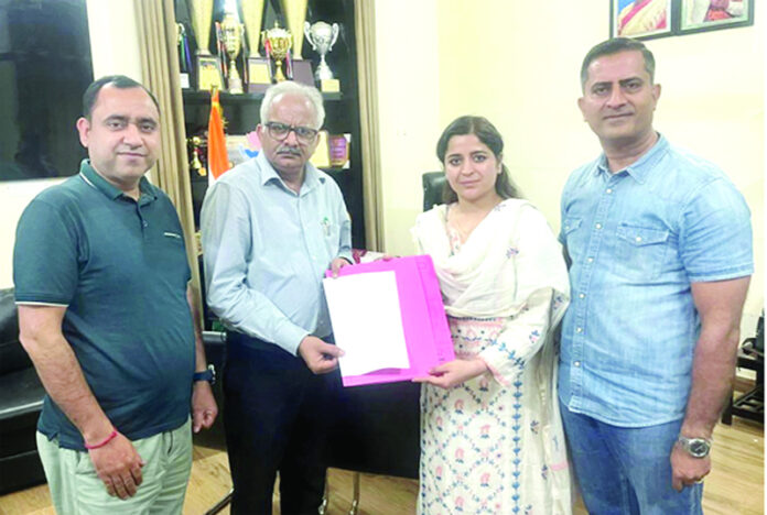 Principal of GGM Science College and Director, Rapture Biotech displaying copy of MoU signed by them on Tuesday.