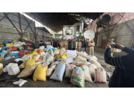 Police officials during disposal of over 1000 kg of narcotics at Lassipora in Pulwama.