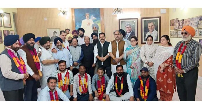NC’s Provincial president, R L Gupta, other leaders and workers, during a meeting in Jammu South on Thursday.