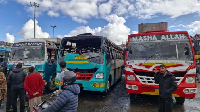 Buses damaged in blaze. -Excelsior/Aabid Nabi