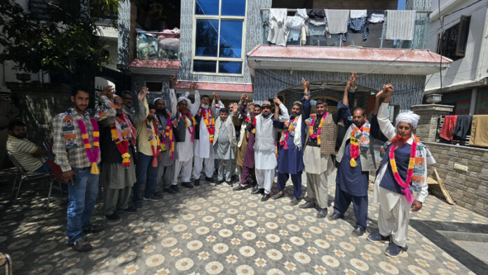 MLA Rajouri Iftkhar Ahmed with the newly inducted party members in Rajouri. MLA Rajouri Iftkhar Ahmed with the newly inducted party members in Rajouri.