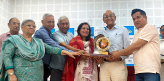 Dogri writer Ritu Singh receiving Prof. Ramnath Shastri Memorial Award 2026 during a function in Jammu.