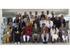 Dignitaries posing along with participants during a programme at IIM Jammu.