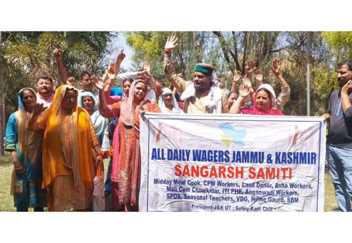 Daily wagers holding protest at Kathua on Monday. — Excelsior/Nishant