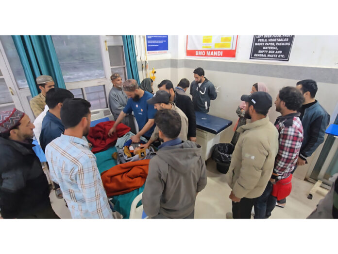 Injured persons being treated at SDH Mandi. — Excelsior/Waseem