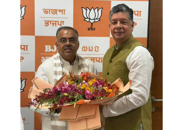 Senior BJP leader, Assem Gupta during a meeting with party national general secretary, Tarun Chugh.